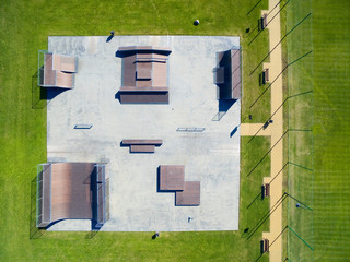 Aerial view of outdoor skatepark with various ramps