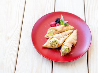 The Cannoli with Pistachio on the Wooden Background, Typical Sicilian Sweets