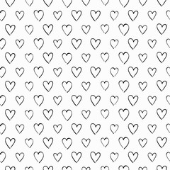 Black and white seamless vector pattern with hand drawn heart shape elements.