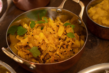 Indian cabbage curry served in copper bowl