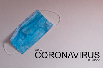 Text phrase Coronavirus on a gray background with protective masks. Novel coronavirus 2019-nCoV, MERS-Cov middle East respiratory syndrome coronavirus.