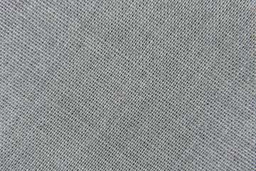 Fototapeta na wymiar background weaving of gray fabric closeup