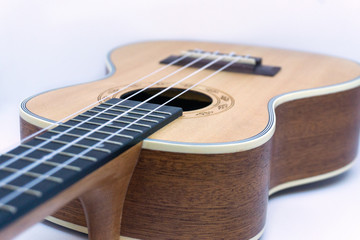 Brown ukulele hawaiian guitar isolated on white background