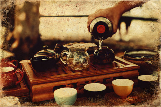 Tea set for tea ceremony and old photos effect with border.
