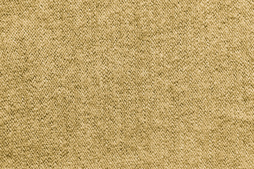 Beige texture of knitted wool textile material background. beige wool fabric texture