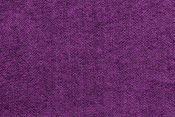 Purple knitted wool fabric texture background
