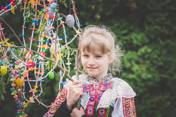 Happy easter compliment from girl in national folk costume