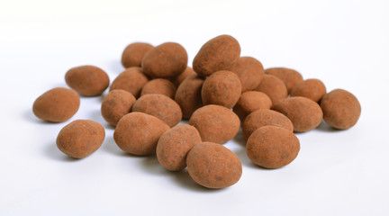 Sweets with almonds and cocoa powder. Isolated On white background