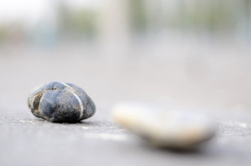 Pebbles stacked in front of a hazy background