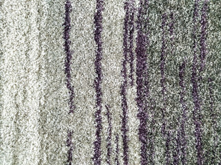 Abstract pattern design of colorful carpet in warm and fluffy texture for modern styling of the home interior and an interesting background