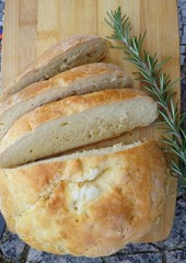 Traditional Serbian pogaca bread on wooden table, macro, food