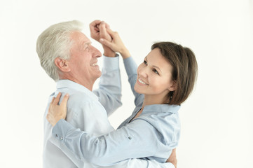 Close up portrait of father and daughter dancing