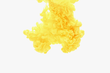 Abstract yellow ink in water on white background