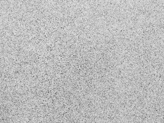 Solid ceramic tiles with tiny dots and rough surface used in home decoration for floors or walls in kitchen or bathroom and a background