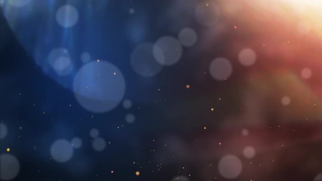Abstract defocused blur bokeh particles dropping on blue and orange color background. Decoration backdrop and wallpaper concept. Full HD footage video
