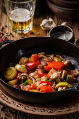 European cuisine in Ukrainian style. Warm grilled vegetable salad with beer in smoke. Serving meals in a rustic restaurant. background image, copy space text