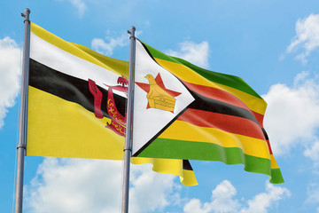 Zimbabwe and Brunei flags waving in the wind against white cloudy blue sky together. Diplomacy concept, international relations.