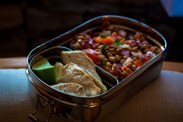 Lunchbox with lentil salad and grill chicken breast 