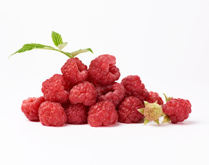 red ripe raspberries and green leaf on a white background