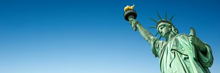 Acrylic prints Statue of liberty Statue of Liberty in New York, USA. Blue sky panoramic background with copy space
