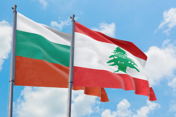 Lebanon and Bulgaria flags waving in the wind against white cloudy blue sky together. Diplomacy concept, international relations.