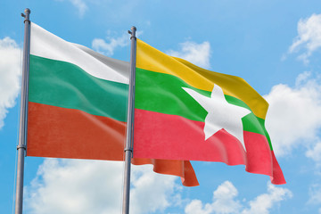 Myanmar and Bulgaria flags waving in the wind against white cloudy blue sky together. Diplomacy concept, international relations.