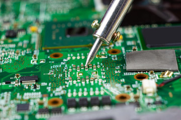 soldering iron for repairing electronic of the computer circuit board concept technology of...