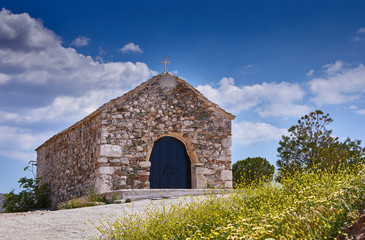 Greek orthodox chapel. Incredibly romantic sunrise before wedding.  Spring light on the Greek coast, Aegean sea. Old traditional Greek church. Romantic place for wedding..