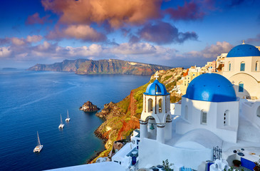Fira town on Santorini island, Greece. Incredibly romantic sunrise on Santorini. Oia village in the morning light. Amazing sunset view with white houses. Island of lovers - obrazy, fototapety, plakaty