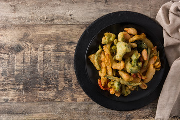 Japanese vegetable tempura on wooden table. Top view copy space