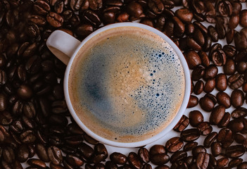 cup of coffee with beans background