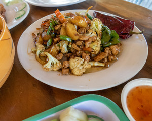 Selection of burmese dishes in rural Myanmar with skinny chicken and traditional soup