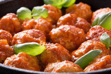 Traditional italian Meatballs served on a old wooden table. Meatballs served on a old wooden table with green napkin and spoon. Homemade delicious italian Meatballs on on a rustic table for dinner. it