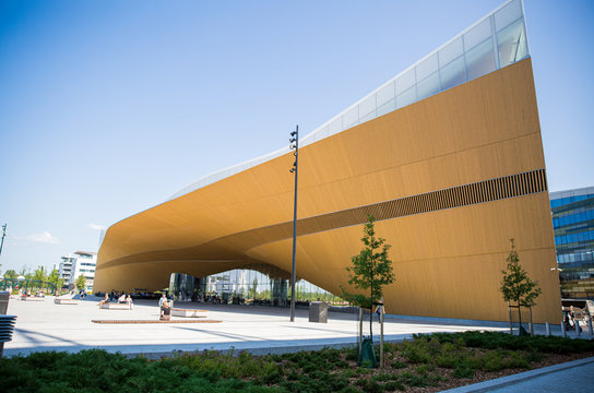 Helsinki, Finland- July 25 2019: New Helsinki central library Oodi exterior. Modern northern architecture. Entrance of the building on city square, sunny summer day.