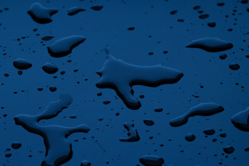 Abstract Background Of Deep Blue Water Drops on Blue Surface