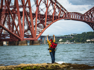 Fort Railroad Bridge Edinburgh, Scotland, Europe. Active adult traveler, middle-aged woman with a...