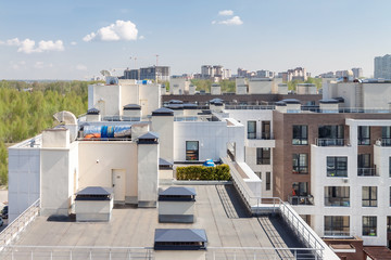 Flat roof with air conditioners on top modern apartment house building exterior mixed-use urban multi-family residential district area development. - obrazy, fototapety, plakaty