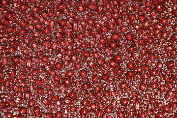 Water texture on a red background.