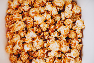 top view sweet caramelized candied popcorn in a white box