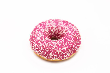 Donut with pink icing and white sprinkles isolated on white background.
