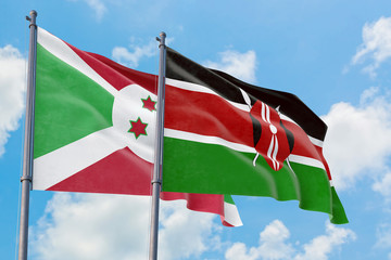 Kenya and Burundi flags waving in the wind against white cloudy blue sky together. Diplomacy concept, international relations.