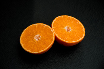 juice orange on black background