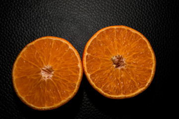 juice orange on black background