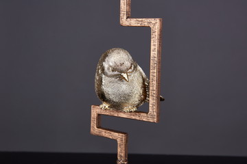 A Golden Bird Ornament commonly used by people in China and Asia. It can symbolize wealth and good luck