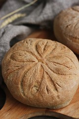 Delicious white bread with rye on the table 
