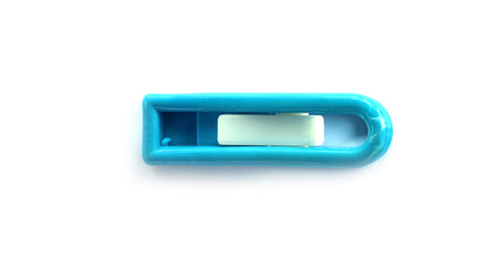 Plastic blue clothes peg isolated on white background