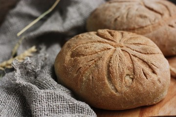 Fototapeta premium Delicious white bread with rye on the table 
