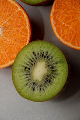 kiwi and orange on white background