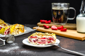 Sugar free homemade strawberry cheese roll, healthy food, proper nutrition dessert with fruit. Coffee with milk and pastry for breakfast