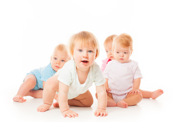 Group of funny babies sitting on white background, isolated